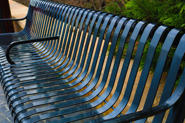 Black iron bench at the park	