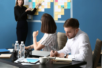 Young business people at meeting in office