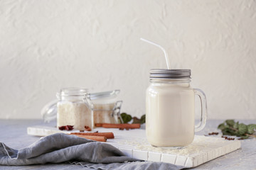 Mason jar of healthy rice milk on table