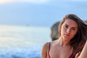 Naklejka premium young woman on the beach