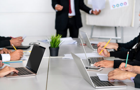 Senior leader speaker speaks to public people audience in training workshop or conference. Mature lecturer is CEO executive manager leading the symposium event. International business seminar concept.