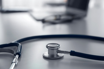 Medical stethoscope on table