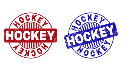 Grunge HOCKEY round stamp seals isolated on a white background. Round seals with grunge texture in red and blue colors. Vector rubber imprint of HOCKEY caption inside circle form with stripes.