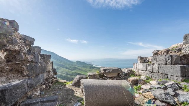 up left to right pan of roman ruins in the  archaeological site of  Susita. With the Sea of Galilee in background, Israel time lapse.