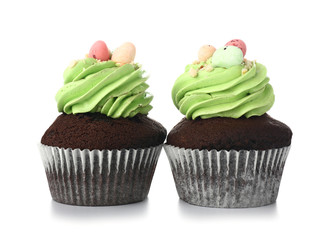 Sweet Easter cupcakes on white background