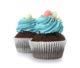 Sweet Easter cupcakes on white background