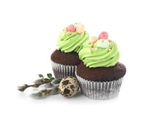Sweet Easter cupcakes on white background