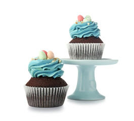 Sweet Easter cupcakes on white background