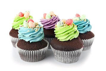 Sweet Easter cupcakes on white background