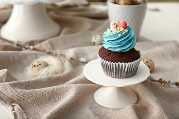 Sweet Easter cupcake on table