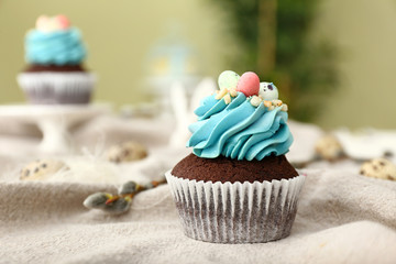 Sweet Easter cupcake on table