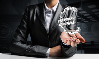 Businessman presenting euro symbol.
