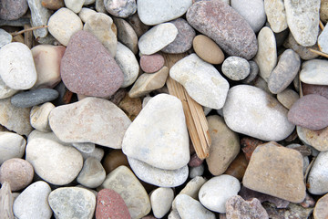 Lot of pebble on the beach background