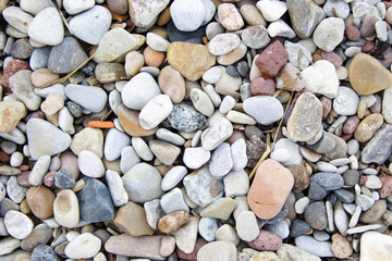 Lot of pebble on the beach background