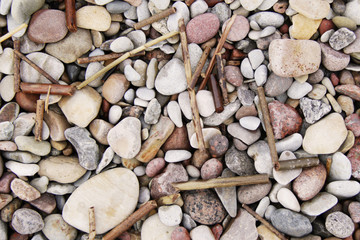 Lot of pebble on the beach background