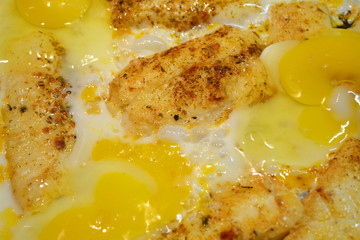 Fried omelet macro details surface. Gourmet breakfast or brunch. Food background. Chicken organic eggs. Rustic homemade background.