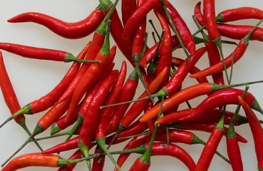 Close-up of red hot chili cayenne peppers handful 