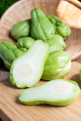 Fresh chayote fruits (Sechium edulis) on wood background