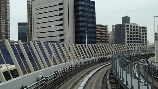 Scenery of a train traveling on the rail of Yurikamome Line in Tokyo from Shimbashi station to Odaiba.