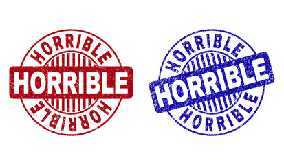 Grunge HORRIBLE round stamp seals isolated on a white background. Round seals with grunge texture in red and blue colors. Vector rubber imitation of HORRIBLE caption inside circle form with stripes.