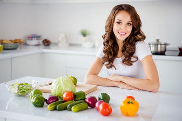 Portrait of her she nice-looking attractive shine lovely sweet cheerful wavy-haired girl housekeeper making fresh lunch dinner farm organic vegs in light white interior room