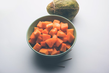 Cantaloupe / muskmelon / kharbuja cut into pieces, served in a bowl. selective focus
