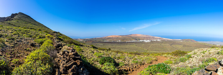 Spain, Lanzarote, XXL panorama of endless winegrowing and cactus fields from edge of volcano corona