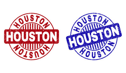 Grunge HOUSTON round stamp seals isolated on a white background. Round seals with grunge texture in red and blue colors. Vector rubber imitation of HOUSTON tag inside circle form with stripes.