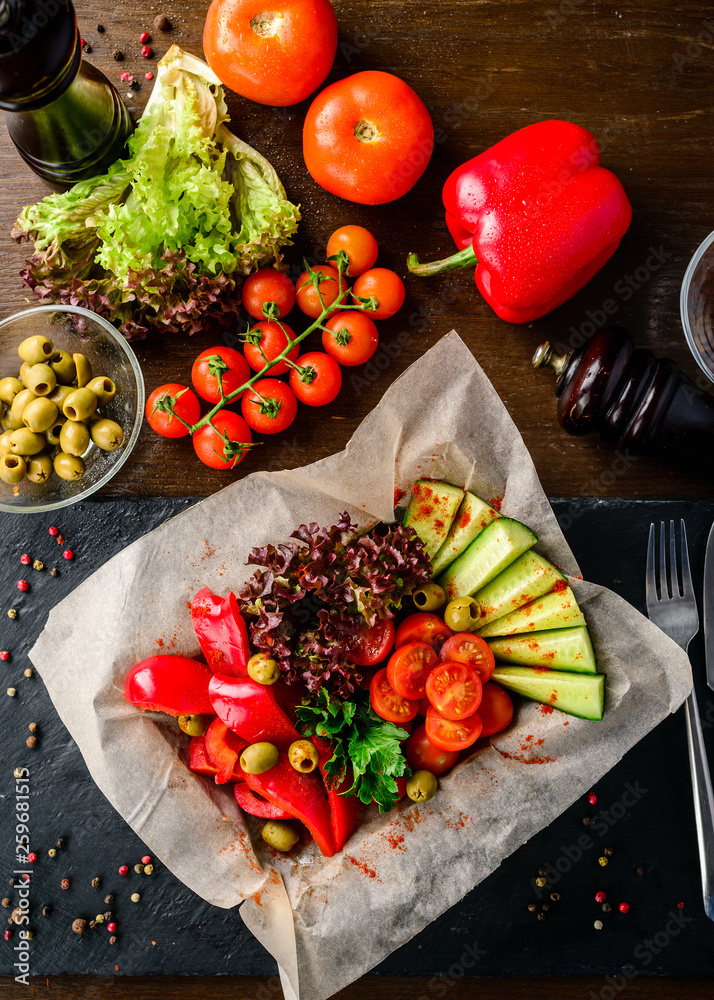 Wall mural fresh vegetables in a restaurant, cucumber, peppers, tomatoes and salad