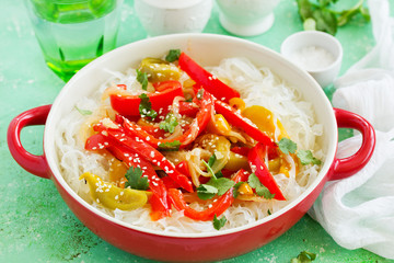 Baked bell peppers with rice noodles in Asian style.