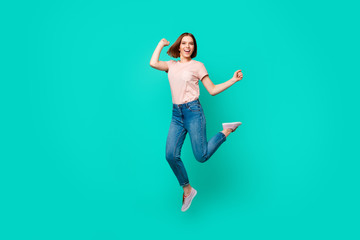 Full length body size photo beautiful amazing her she lady jumping high yell scream shout unexpected success short hairdo wear casual jeans denim pastel t-shirt isolated teal turquoise background
