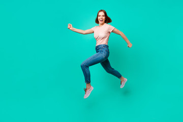 Fototapeta na wymiar Full length side profile body size photo beautiful amazing her she lady flight jump high little prices rush hurry black friday wear casual jeans denim pastel t-shirt isolated teal turquoise background