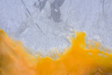 Aerial view of a mining decanting pond with toxic red residuals