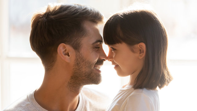 Faces Loving Father And Adorable Daughter Touching Noses