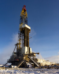 drilling rig tower vertically on a winter morning
