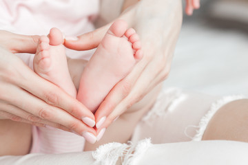 Cute baby`s feet closeup still. Little child. Newborn baby. Tiny fingers.