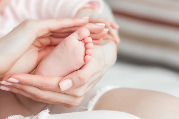 Fototapeta na wymiar Cute baby`s feet closeup still. Little child. Newborn baby. Tiny fingers.