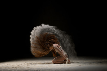 Long-haired blonde in bandage in dust cloud shot
