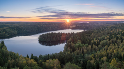 Fototapeta na wymiar Scenic landscape with lake and sunset at evening in Aulanko, nature reserve, Finland