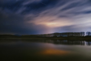 Fototapeta na wymiar View to the dam Koprinka, Bulgaria, by night, cloudy and starry
