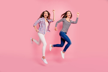 Full length body size view photo of active energetic excited ladies funny enjoy funky laughing laughter having strolls dressed in modern shirts denim trousers isolated on rose-colored background