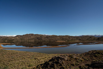 Fototapeta na wymiar lake, mountains and a blue sky