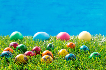 Decorated eggs on green grass