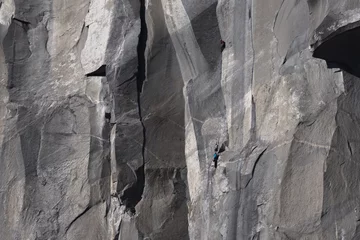 Foto op Aluminium Climbers attempt to climb jagged granite of El Capitan in Yosemite National Park © Tabor Chichakly