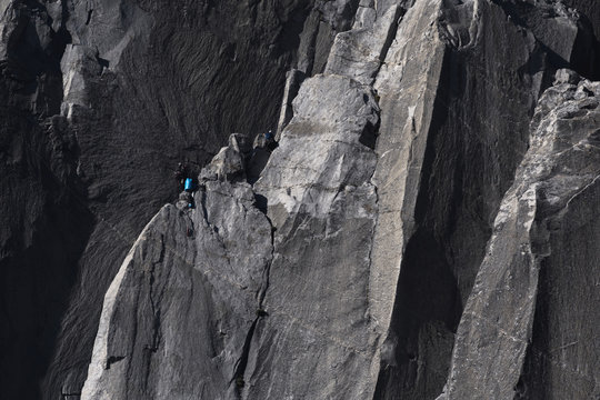 Climbers attempt to climb jagged granite of El Capitan in Yosemite National Park