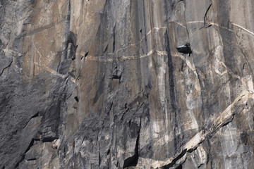 Climbers attempt to climb jagged granite of El Capitan in Yosemite National Park