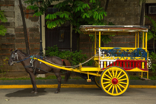 Horse carriage on the street from Manila. Fort Santiago.