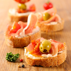 tapas, canape with cheese and ham