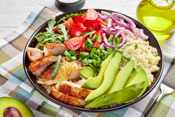 grilled chicken salad in a bowl, close-up
