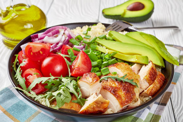 Grilled chicken, couscous, veggies in a bowl